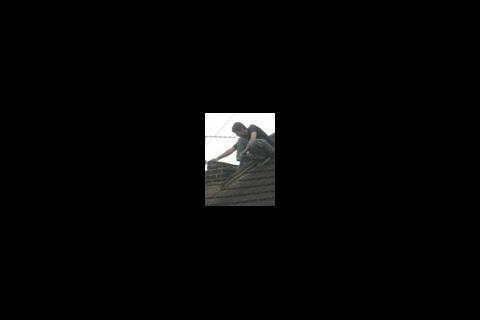 Man on roof in Romford, Essex
